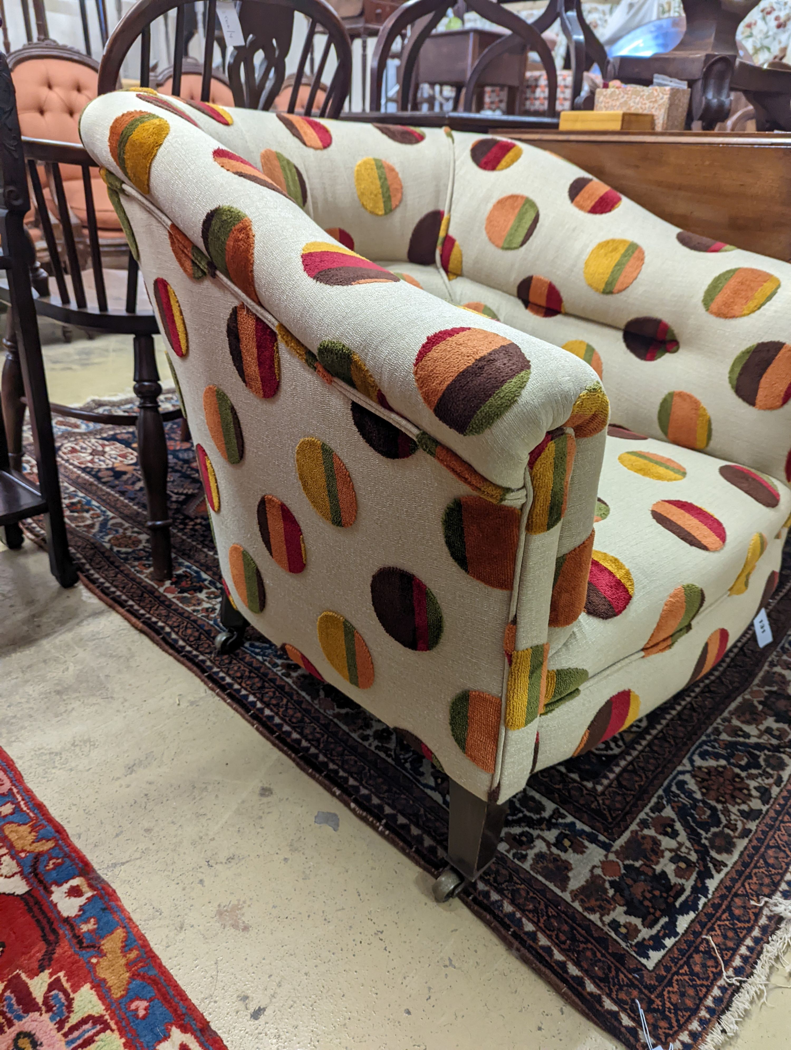 An Edwardian upholstered tub frame armchair, width 76cm, depth 68cm, height 72cm